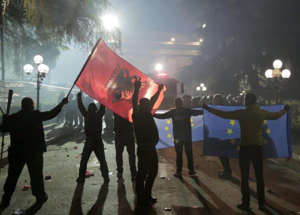 From file: Supporters of the opposition outside parliament during a protest in Tirana against the deal | Photo: Malton Dibra / EPA