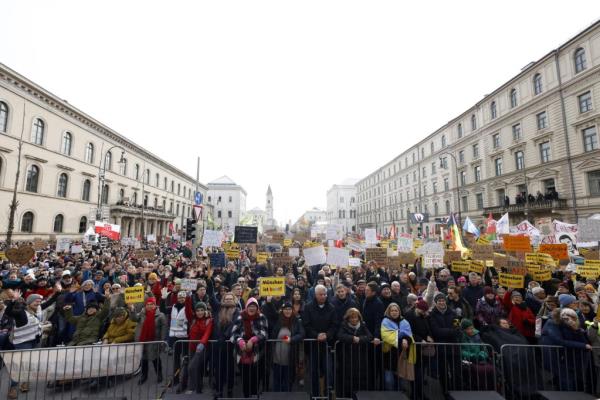 © Michaela Stache, AFP | Protesters hold placards during a demo<em></em>nstration against racism and far-right politics in Munich, southern Germany, on Sunday, January 21, 2024.