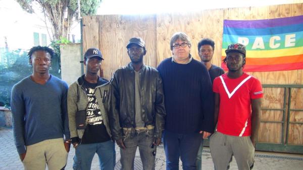 Don Massimo Biancalani is running a center that hosts migrants in Pistoia, Italy. He says that more facilities are needed to host migrants in Italy. Here, he is pictured with some of the people staying at the center | Photo: ANSA