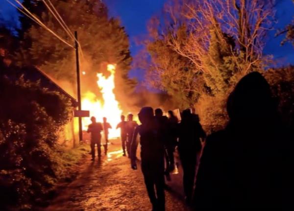 A screenshot from a social media post on X, reproduced by the Irish Times, showing people and a fire at the Trudder House site in Newtown, County Wicklow, Ireland on April 25, 2024