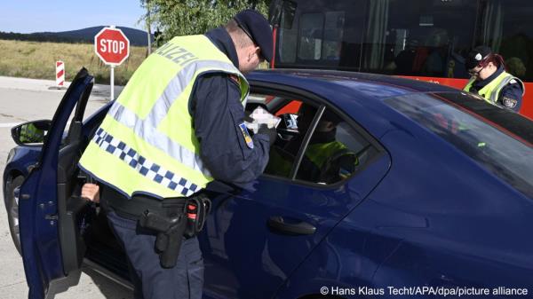 From file: Austrian police check cars at the border in Berg. Austria's Interior Minister says more checks have reduced the number of migrants entering the country | Photo: Hans Klaus Techt/APA/dpa/picture alliance